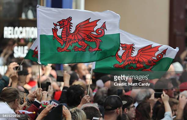 The Welsh team walk out of Cardiff Castle and are welcomed home by fans following their exit from the Euro 2016 championships, on July 8, 2016 in...