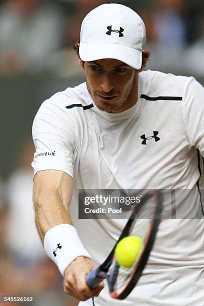 Andy Murray of Great Britain plays a backhand during the Men's Singles Semi Final match against Tomas Berdych of The Czech Republic on day eleven of...