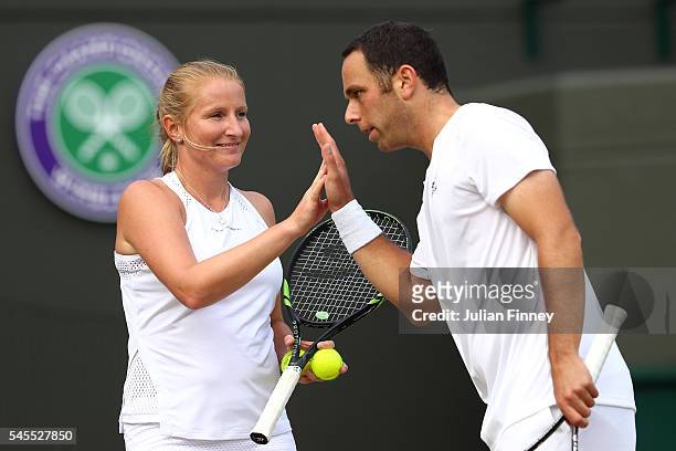 Scott Lipsky of The United States and Alla Kudryavtseva of Russia in conversation during the Mixed Doubles Quarter Finals match against Heather...