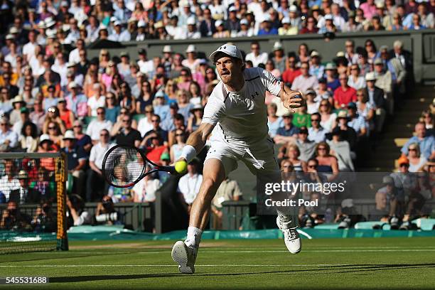 Andy Murray of Great Britain plays a backhand during the Men's Singles Semi Final match against Tomas Berdych of The Czech Republic on day eleven of...