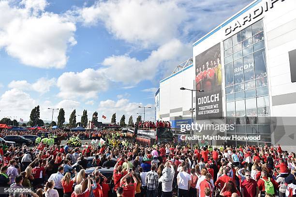 An open top bus carrying the Wales team arrives at the Cardiff City Stadium on July 8, 2016 in Cardiff, Wales. The players toured the streets of...