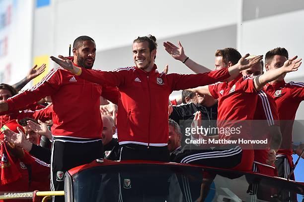 Wales football players Ashley Williams with Gareth Bale as the open top bus arrives at the Cardiff City Stadium on July 8, 2016 in Cardiff, Wales....