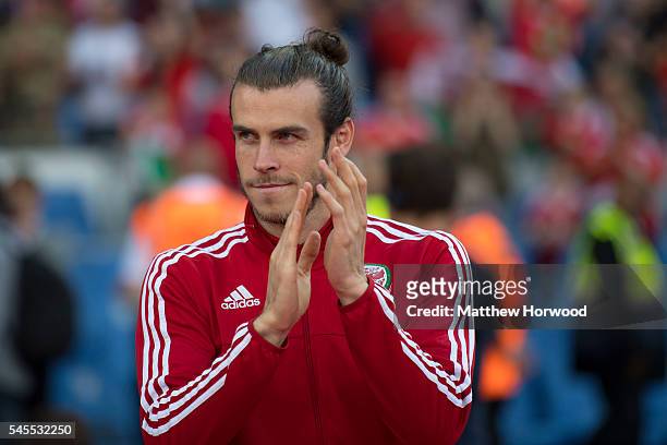 Gareth Bale of Wales looks on during a ceremony at the Cardiff City Stadium on July 8, 2016 in Cardiff, Wales. The players toured the streets of...