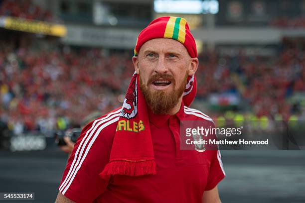 Wales' James Collins walks out into the stadium during a ceremony at the Cardiff City Stadium on July 8, 2016 in Cardiff, Wales. The players toured...
