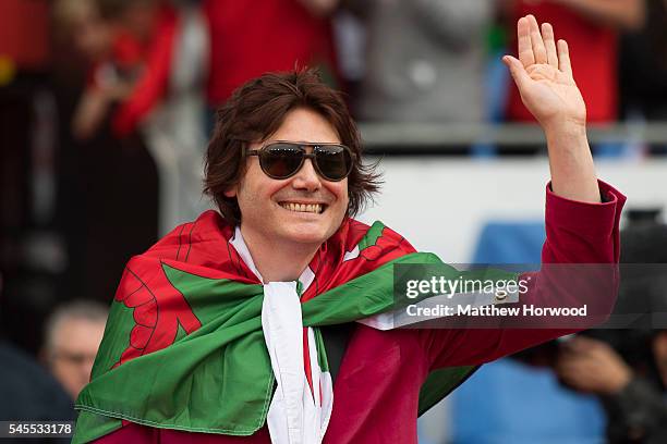 Nicky Wire of the Manic Street Preachers waves to the crowd during a ceremony at the Cardiff City Stadium on July 8, 2016 in Cardiff, Wales. Players...