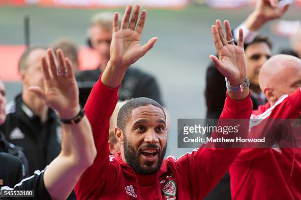 Wales' Ashley Williams waves to the crowd during a ceremony at the Cardiff City Stadium on July 8, 2016 in Cardiff, Wales. The players toured the...