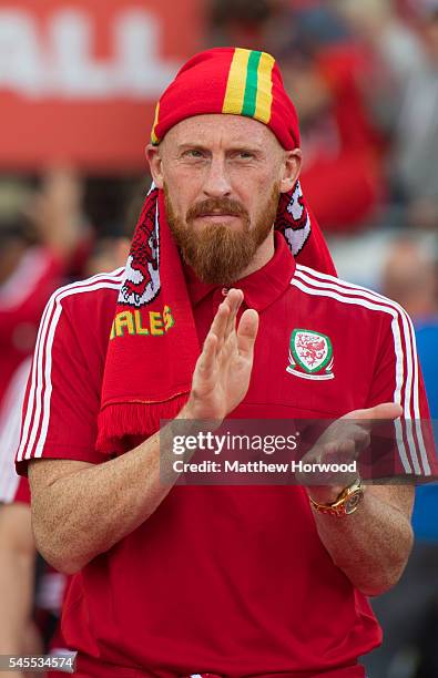 Wales' James Collins walks out into the stadium during a ceremony at the Cardiff City Stadium on July 8, 2016 in Cardiff, Wales. The players toured...