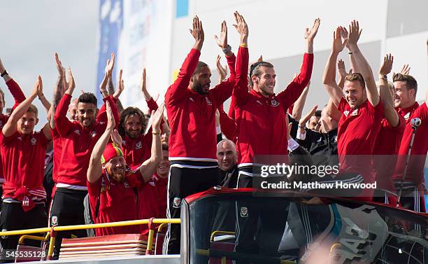 Wales players arrive at the Cardiff City Stadium on an open top bus on July 8, 2016 in Cardiff, Wales. The players toured the streets of Cardiff in...