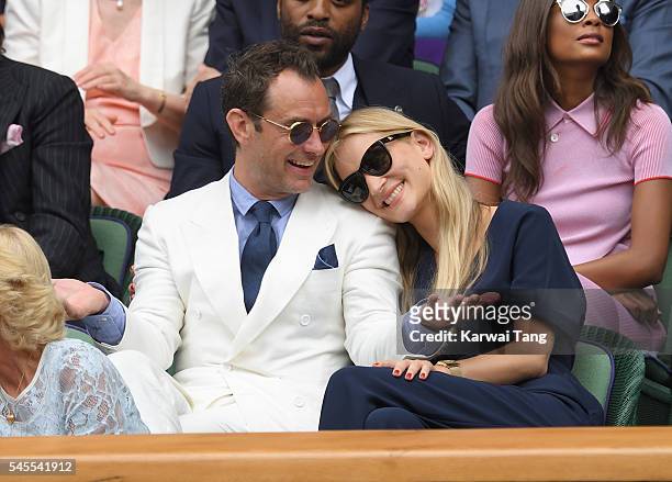 Jude Law and Phillipa Coan attend day eleven of the Wimbledon Tennis Championships at Wimbledon on July 08, 2016 in London, England.