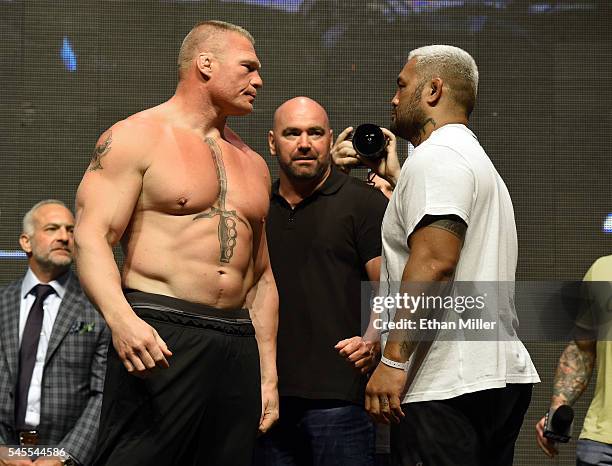 President Dana White looks on as mixed martial artists Brock Lesnar and Mark Hunt face off during their weigh-in for UFC 200 at T-Mobile Arena on...