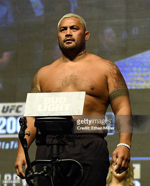 Mixed martial artist Mark Hunt poses on the scale during his weigh-in for UFC 200 at T-Mobile Arena on July 8, 2016 in Las Vegas, Nevada. Hunt will...