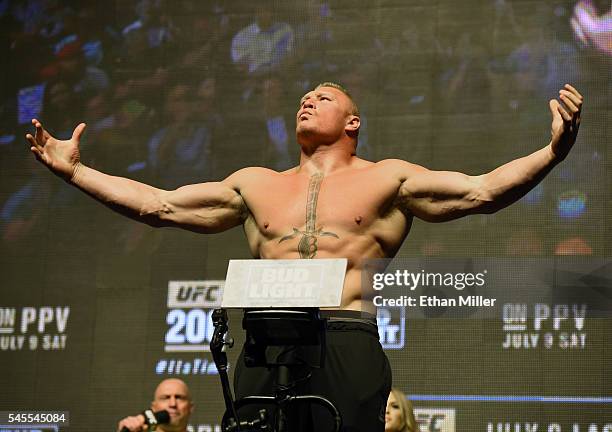 Mixed martial artist Brock Lesnar poses on the scale during his weigh-in for UFC 200 at T-Mobile Arena on July 8, 2016 in Las Vegas, Nevada. Lesnar...