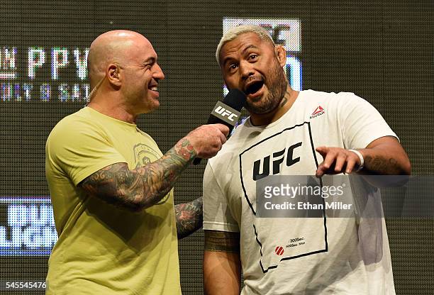 Commentator Joe Rogan interviews mixed martial artist Mark Hunt after his weigh-in for UFC 200 at T-Mobile Arena on July 8, 2016 in Las Vegas,...