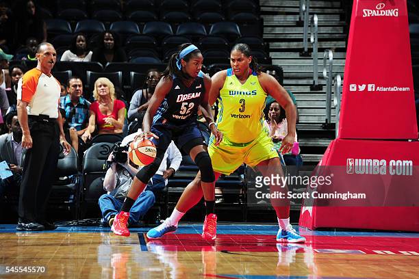 Elizabeth Williams of the Atlanta Dream moves the ball against Courtney Paris of the Dallas Wings on July 8, 2016 at Philips Arena in Atlanta,...