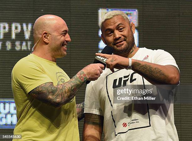 Commentator Joe Rogan interviews mixed martial artist Mark Hunt after his weigh-in for UFC 200 at T-Mobile Arena on July 8, 2016 in Las Vegas,...