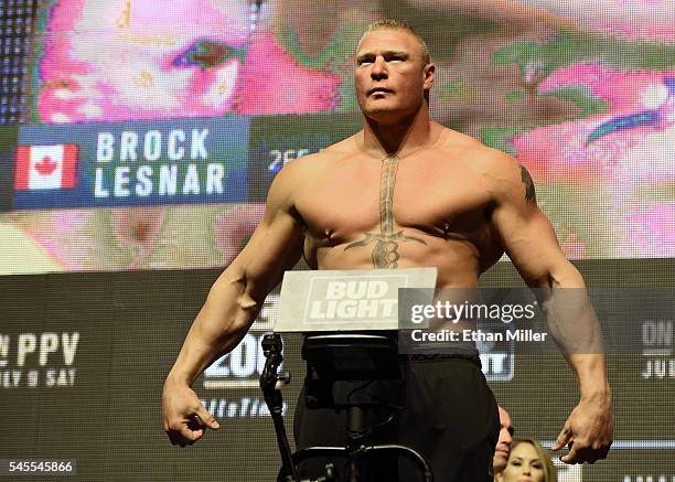 Mixed martial artist Brock Lesnar poses on the scale during his weigh-in for UFC 200 at T-Mobile Arena on July 8, 2016 in Las Vegas, Nevada. Lesnar...