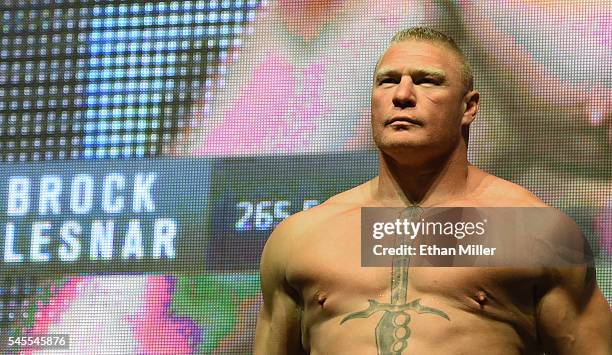 Mixed martial artist Brock Lesnar poses on the scale during his weigh-in for UFC 200 at T-Mobile Arena on July 8, 2016 in Las Vegas, Nevada. Lesnar...