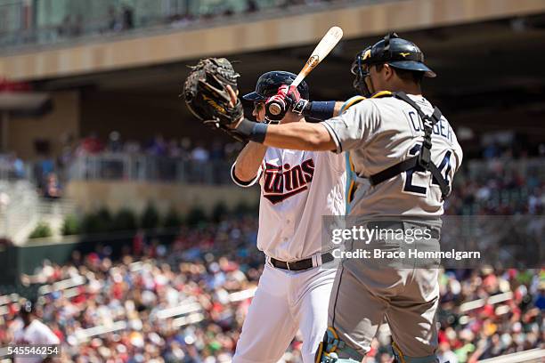 Joe Mauer of the Minnesota Twins is intentionally walked in front of Hank Conger of the Tampa Bay Rays against the Tampa Bay Rays on June 5, 2016 at...