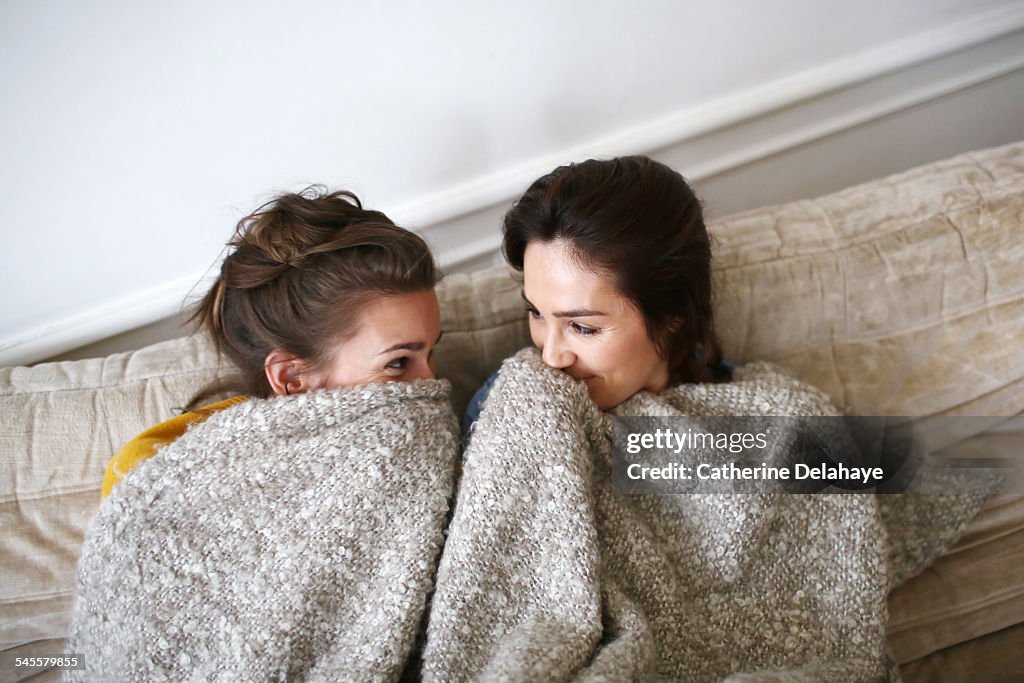 Two friends laughing together