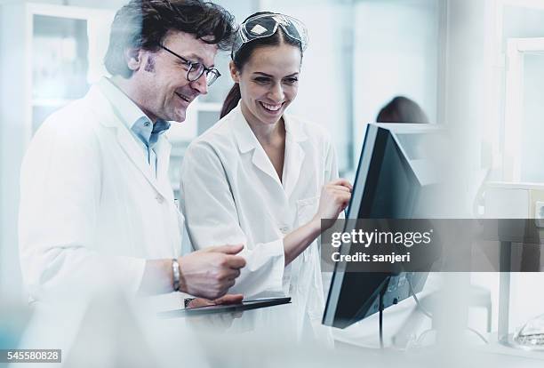 scientists working at the laboratory - doctor and engineer stock pictures, royalty-free photos & images