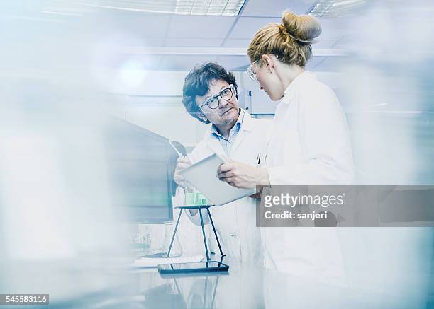 scientist working at the laboratory - doctor and engineer stock pictures, royalty-free photos & images