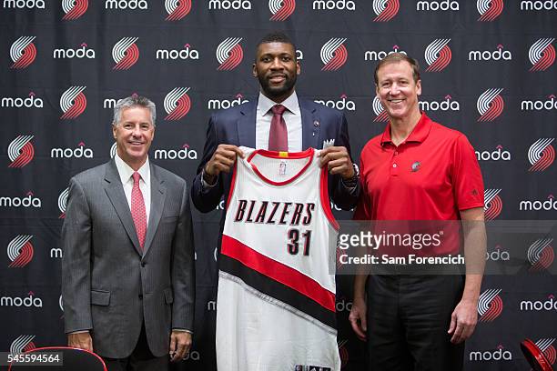 Festus Ezeli of the Portland Trail Blazers is introduced to the media by team General Manager Neil Olshey and Head Coach Terry Stotts July 8, 2016 at...