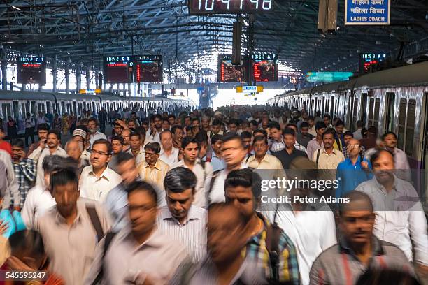 people and trains, chhatrapati shivaji terminus - mumbai local stock pictures, royalty-free photos & images