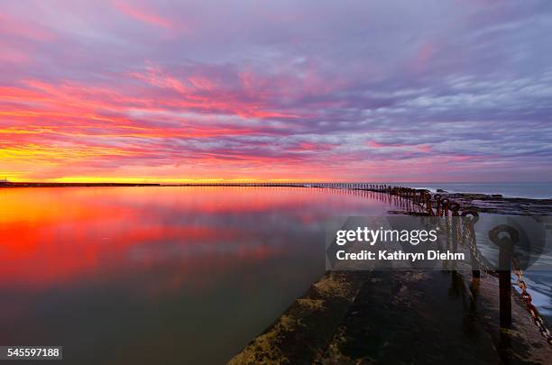 newcastle canoe pool reflection sunrise - newcastle new south wales stock pictures, royalty-free photos & images
