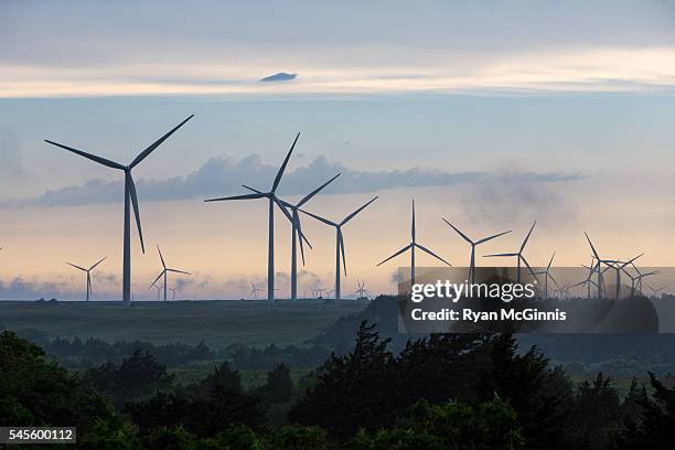 wind turbines at sunset - oklahoma stock pictures, royalty-free photos & images