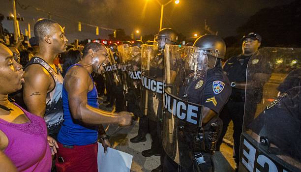 baton-rouge-la-july-08-protesters-face-off-with-baton-rouge-police-in-riot-gear-across-the.jpg