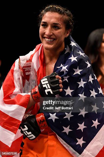 Tatiana Suarez celebrates after defeating Amanda Cooper in their women's strawweight bout during The Ultimate Fighter Finale event at MGM Grand...