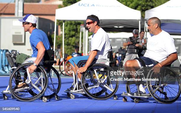 Comedian Adam Sandler plays in a celebrity wheelchair basketball game during the 2nd Annual Angel City Games at UCLA's Drake Stadium on July 8, 2016...