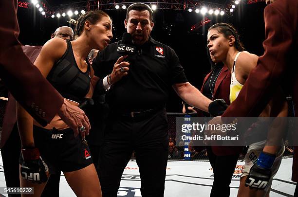 Opponents Joanna Jedrzejczyk of Poland and Claudia Gadelha of Brazil face off before their women's strawweight championship bout during The Ultimate...