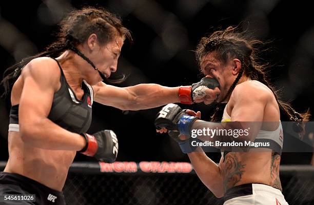 Joanna Jedrzejczyk of Poland punches Claudia Gadelha of Brazil in their women's strawweight championship bout during The Ultimate Fighter Finale...