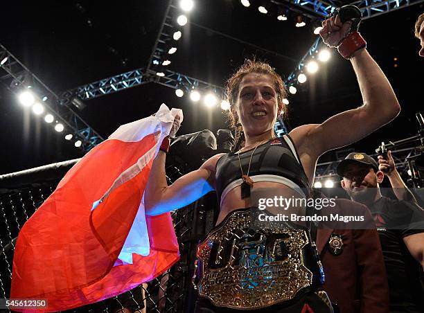 Joanna Jedrzejczyk of Poland celebrates after her victory over Claudia Gadelha in their women's strawweight championship bout during The Ultimate...