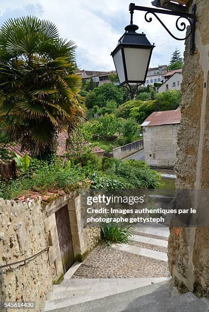 the rustic street lamp above turning staircase - charente fotografías e imágenes de stock