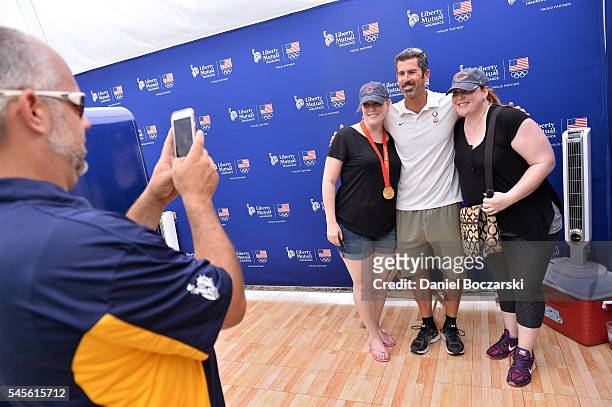 Beach volleyball player Todd Rogers poses with fans during Team USA Road to Rio at the Taste of Chicago at Grant Park on July 8, 2016 in Chicago,...