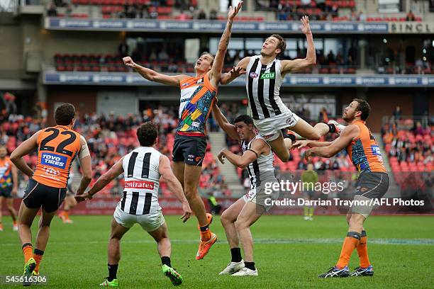 Darcy Moore of the Magpies flies for the ball during the round 14 AFL match between the Greater Western Sydney Giants and the Carlton Blues at...