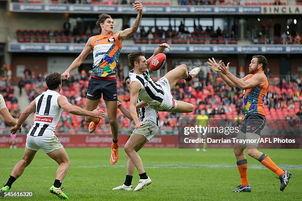 Darcy Moore of the Magpies flies for the ball during the round 14 AFL match between the Greater Western Sydney Giants and the Carlton Blues at...