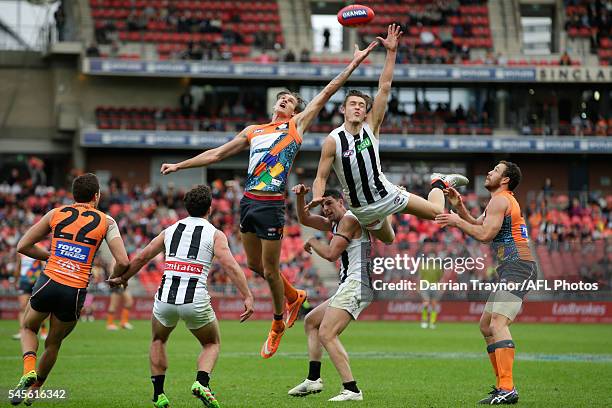 Darcy Moore of the Magpies flies for the ball during the round 14 AFL match between the Greater Western Sydney Giants and the Carlton Blues at...
