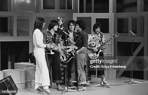 Bay City Rollers with singer Alan Merrill of the band Arrows appearing on 'Arrows' TV Show, Granada TV, Quay Street Studios, Manchester, United...