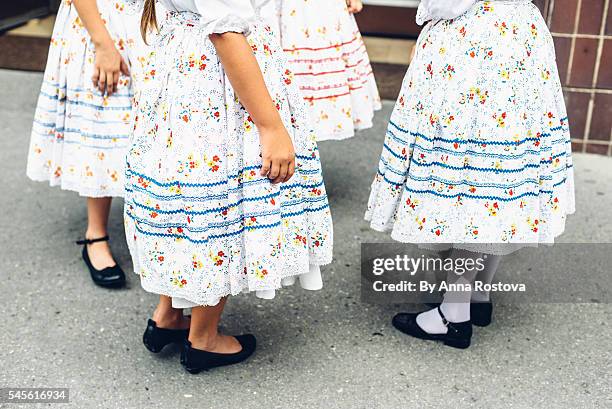 lower parts of preteen girls in hungarian traditional folk costumes - 民族舞踊 ストックフォトと画像