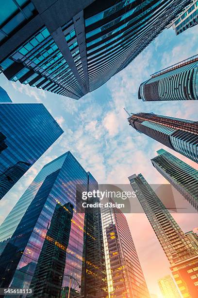 low angle view of skyscrapers in toronto downtown - toronto city stock pictures, royalty-free photos & images