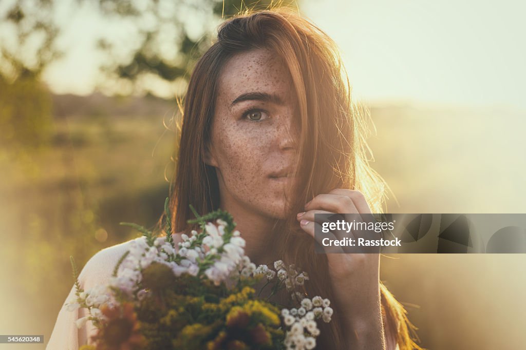 Artistic portrait of freckled woman