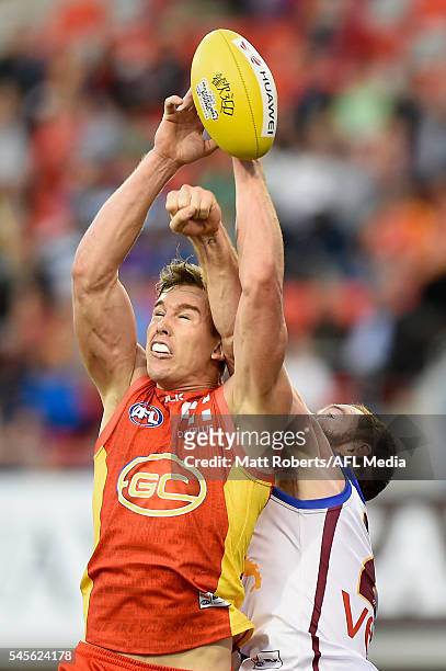 Tom Lynch of the Suns competes for the ball during the round 16 AFL match between the Gold Coast Suns and the Brisbane Lions at Metricon Stadium on...