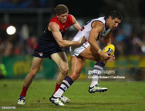 Mattew Pavlich of the Dockers is challenged by Sam Frost of the Demons during the round 16 AFL match between the Melbourne Demons and the Fremantle...