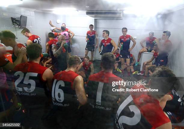The Demons are seen in the cool room during the quarter time break during the round 16 AFL match between the Melbourne Demons and the Fremantle...