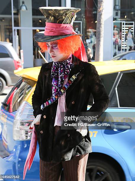 Performer dressed as Johnny Depp in "Alice in Wonderland" is seen on July 8, 2016 in Los Angeles, California. A recent City of LA ordinance calls for...