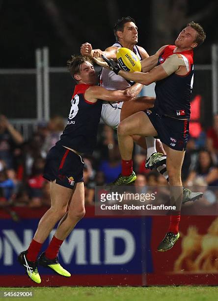 Bernie Vince of the Demons marks the ball in front of Mattew Pavlich of the Dockers during the round 16 AFL match between the Melbourne Demons and...