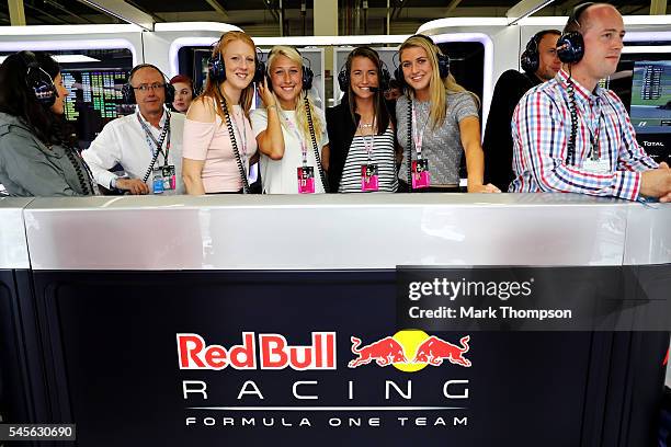 England and Team GB hockey players Nicola White, Steph Elliot, Maddie Hinch and Lily Owsley in the Red Bull Racing garage during qualifying for the...